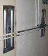 Foundation wall anchor plates installed in a basement in Philadelphia