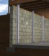 I-beam foundation wall supports installed in a Darby basement.