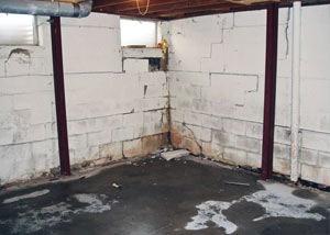 A failed, rusty i-beam foundation wall system installed in Malvern.