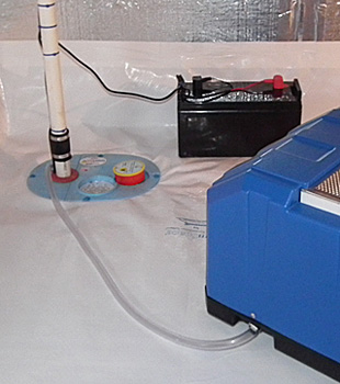 Closeup of a crawl space sump pump installed in Cherry Hill