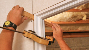 Installing trim and finishing touches to a remodeled basement in Dundalk, PA, DE, and MD