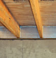 SilverGlo™ insulation installed in a floor joist in Essex