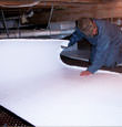 Lancaster insulation being installed in a crawl space.