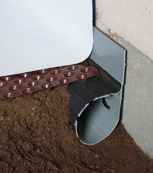 Closeup of a crawl space drainage system installed in Landenberg