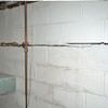 Severe foundation damage from a long crack in a bucking wall