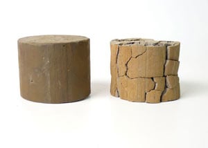 wet and dry clay soil samples, with the dry one shrunken and cracked