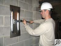 Straighten a bowed foundation wall by wall anchor system