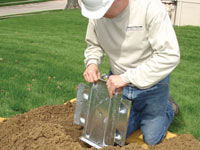 Fastening an earth anchor for a severely bowing wall in Dundalk.
