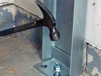 Mounting a foundation channel anchor installation to the floor in Lancaster.