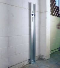 A failing foundation wall repaired with a foundation wall channel anchor system in a Upper Darby home.