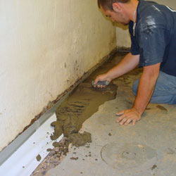 Testing a French drain system in a Gwynn Oak home.