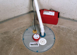 A sump pump system with a battery backup system installed in Media