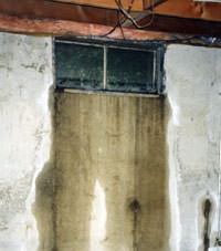Flooding through basement windows in a Phoenix home.