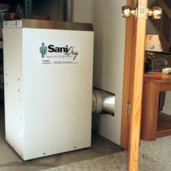 A basement dehumidifier with an ENERGY STAR® rating ducting dry air into a finished area of the basement  in Phoenix