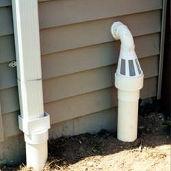 A grated sump pump discharge line fitting in Windsor Mill