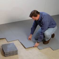 basement subfloor tiles being installed by a contractor in Thornton