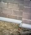 Our baseboard drain system installed on a corner in a Owings Mills basement.