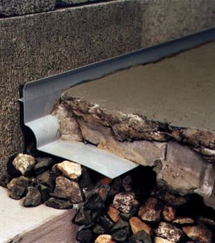 a custom designed basement drain system for thin basement floors in Villanova.