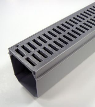 A closeup of our grated basement drainage pipe system, installed in Middle River