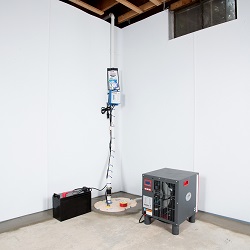 Sump pump system, dehumidifier, and basement wall panels installed during a sump pump installation in Towson