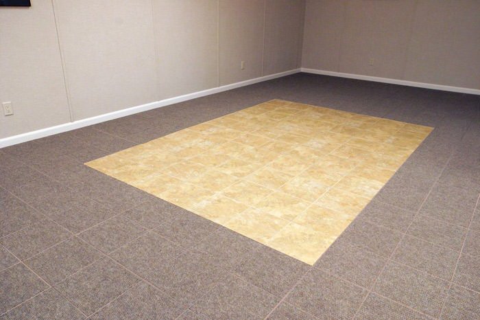 tiled and carpeted basement flooring installed in a Wilmington home