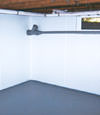 Ellicott City, PA, DE, and MD wet basement wall covering that tucks into a perimeter drainage system