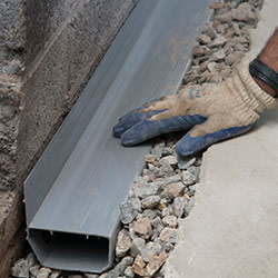 installing a drain tile system in a Media home